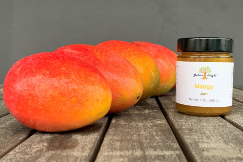 mangos next to a mango jam jar