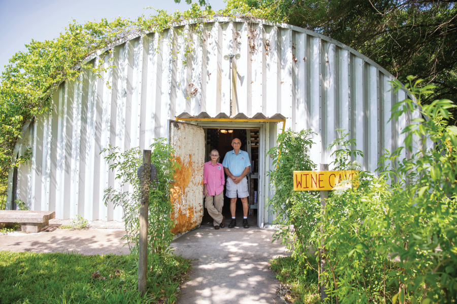 Larry and Lenora Woodham standing in the doorway of the Bunker Hill Vineyard & Winery wine cave