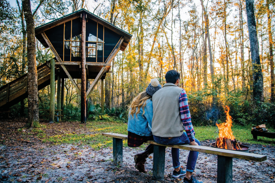 couple at Camp Chowenwaw w fire and sunset
