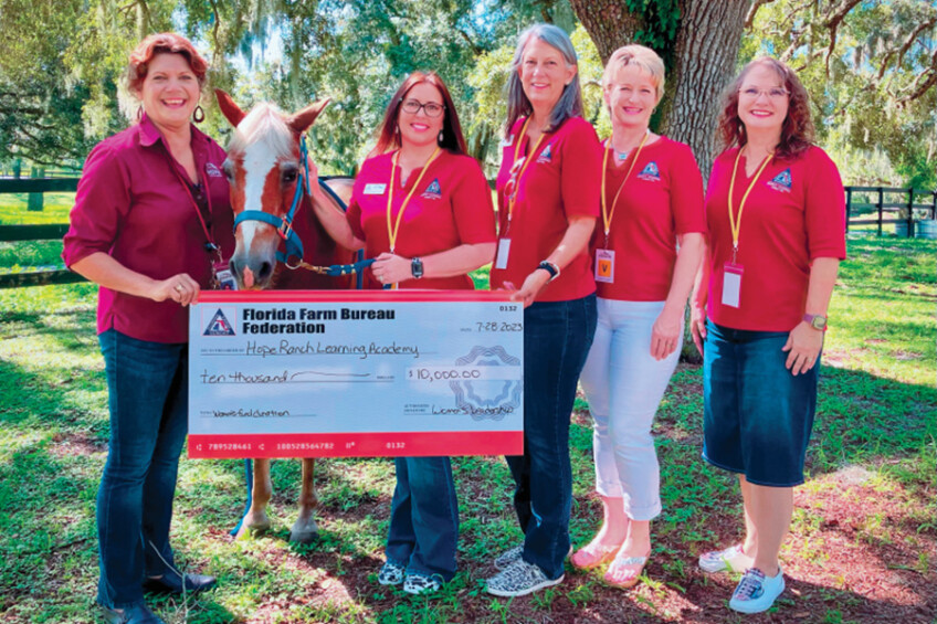 Florida Farm Bureau Women present a large check at Hope Youth Ranch