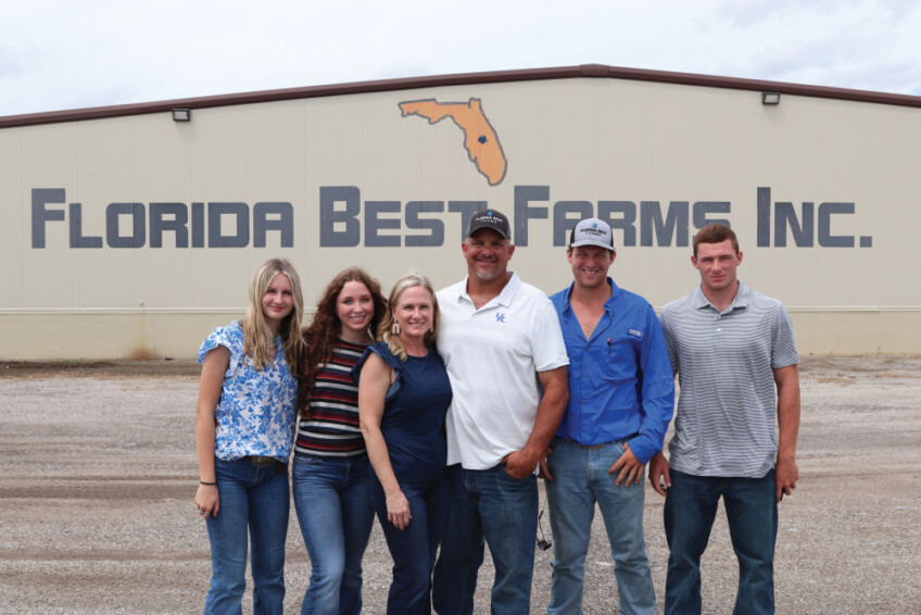 Jason Watts with his family at Florida Best Farms Inc.
